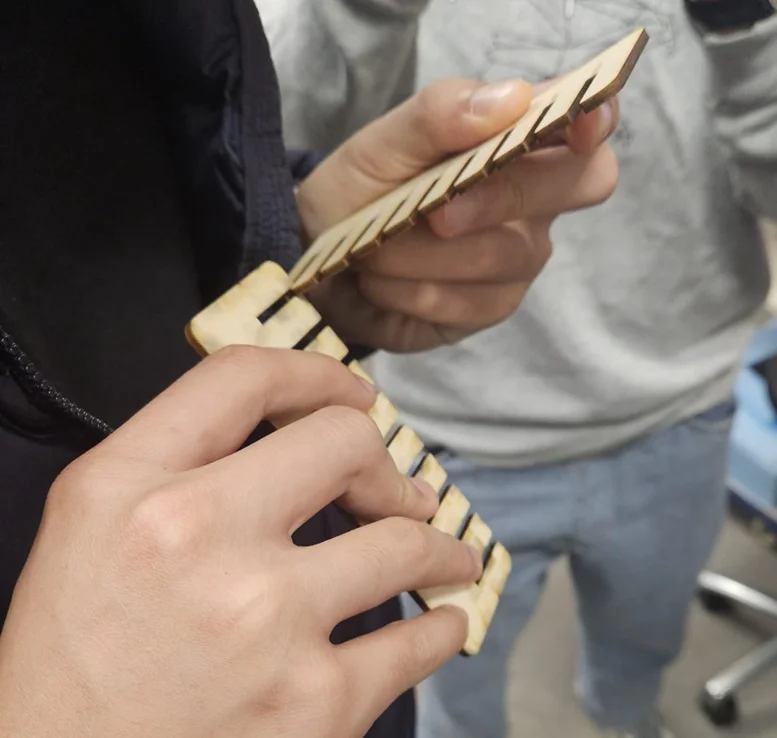 Kerf Test Comb design with labeled tabs and slots used to find correct kerf size.