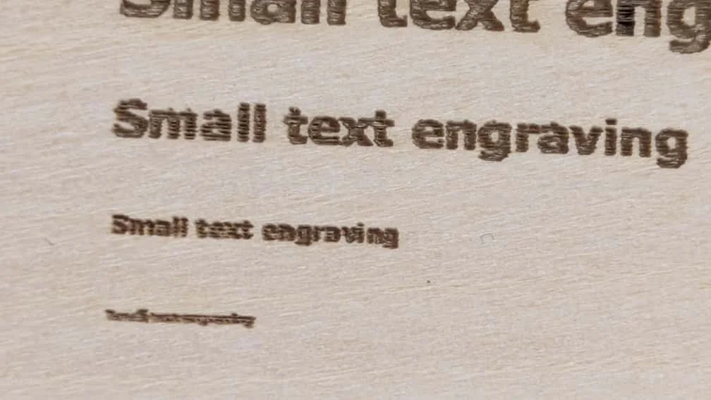 Engraving result on wooden board at 300 DPI resolution.