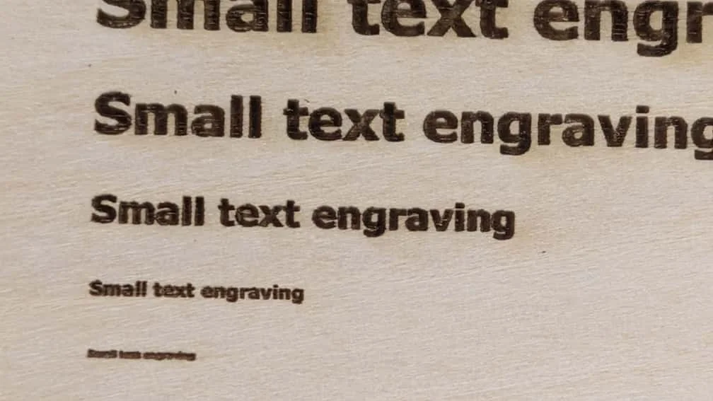 Engraving result on wooden board at 600 DPI resolution.